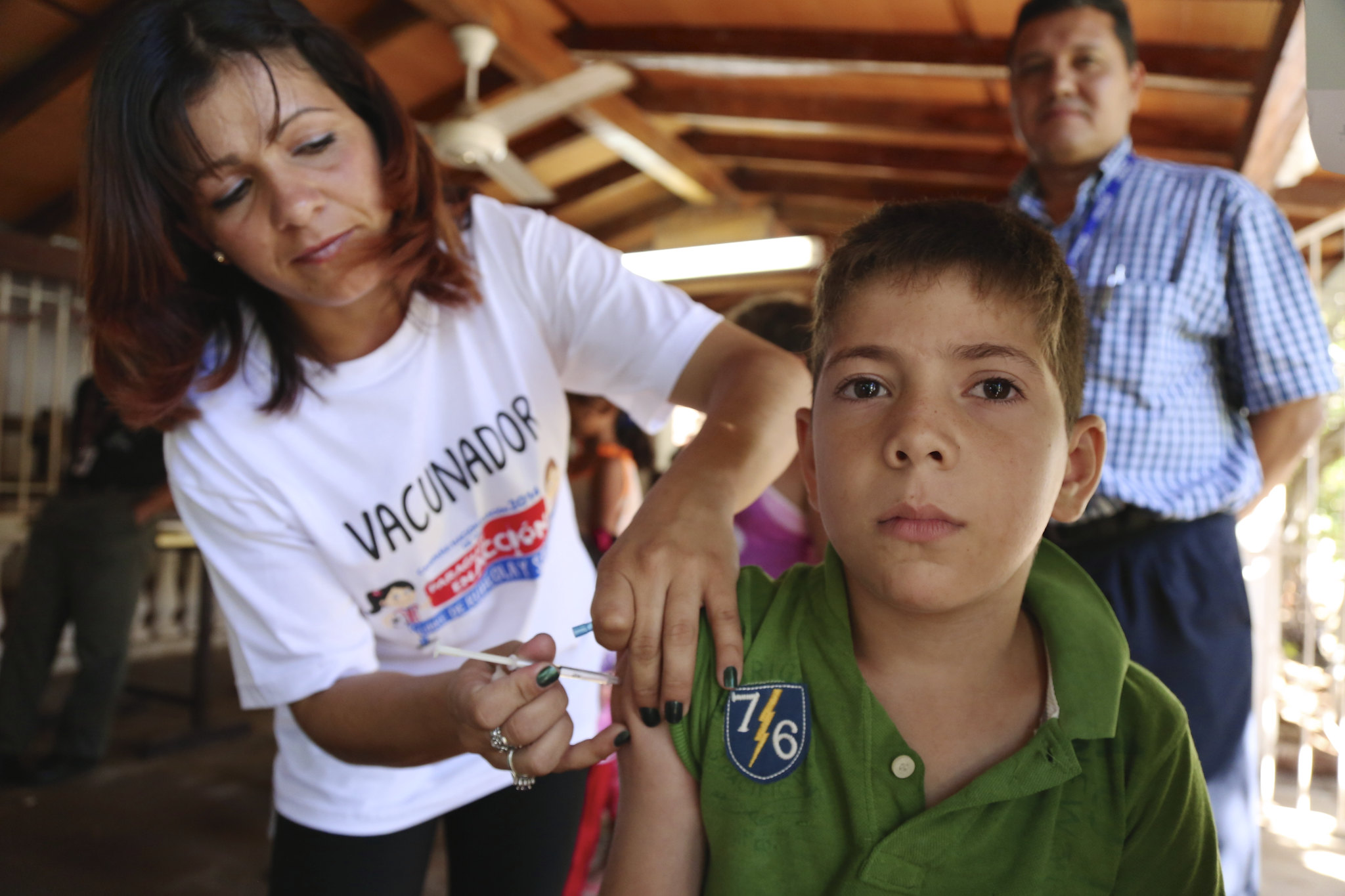 A young Paraguayan boy receives a vaccination during the 2014 'Vaccination Week In The Americas.'