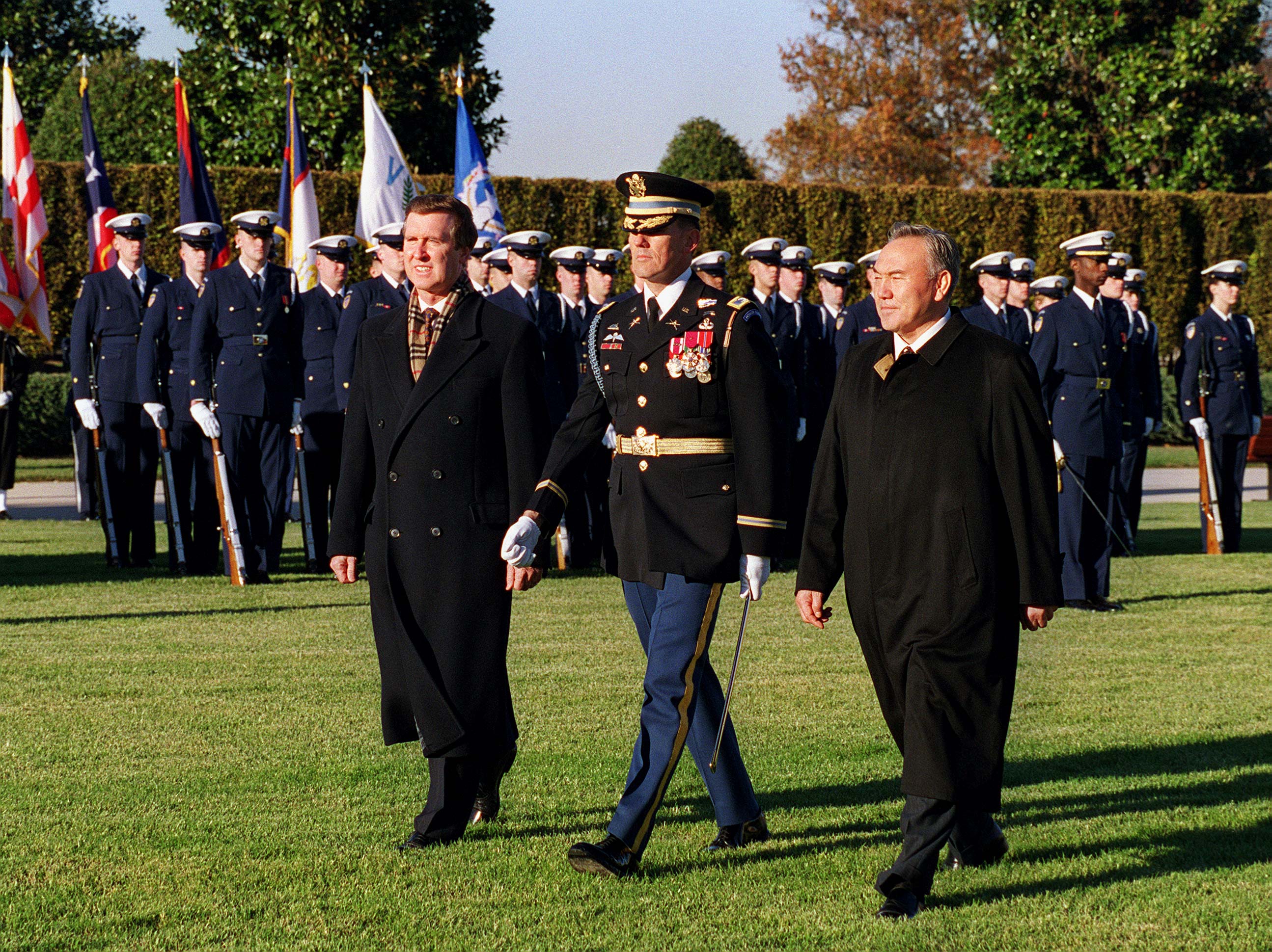 U.S. Secretary of Defense William Cohen (left) and President Nazarbayev (right) inspect a joint services honor guard during an arrival ceremony for Nazarbayev at The Pentagon, 1997.