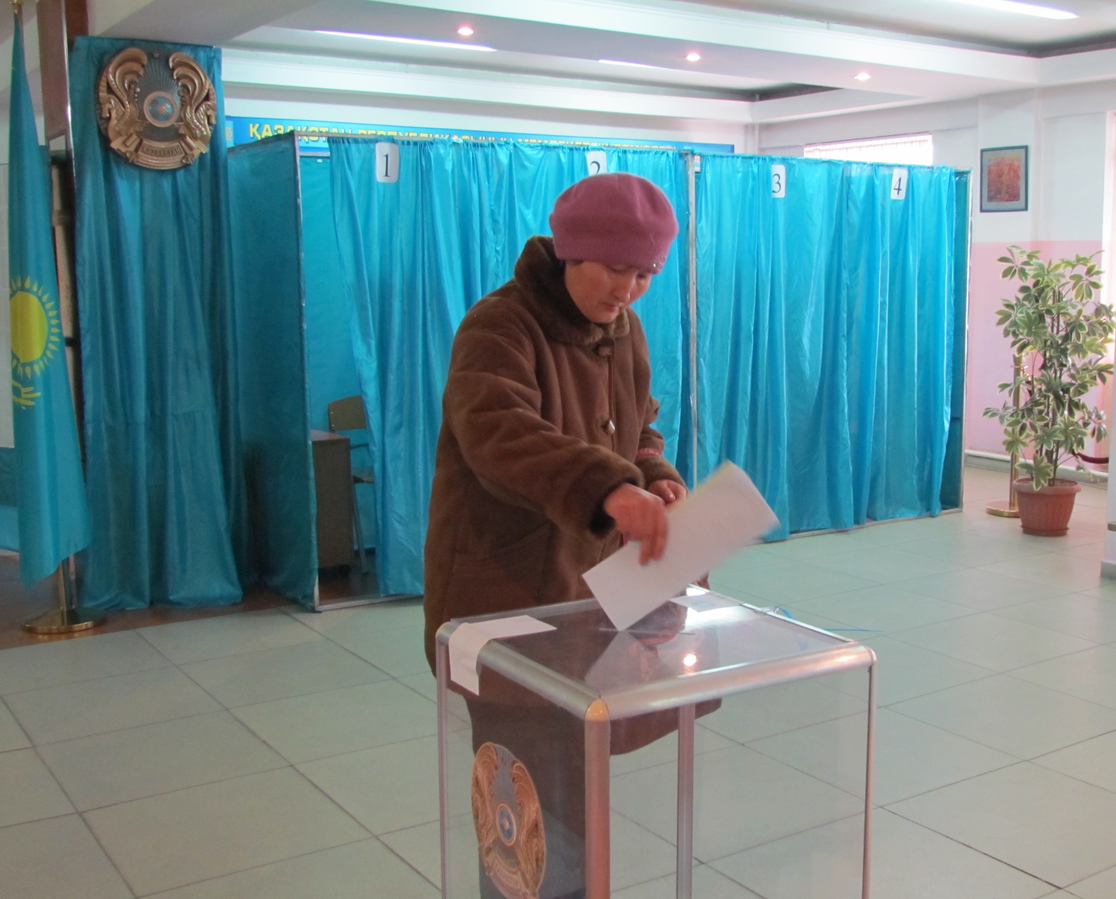 A woman voting in the 2012 Kazakhstan election.