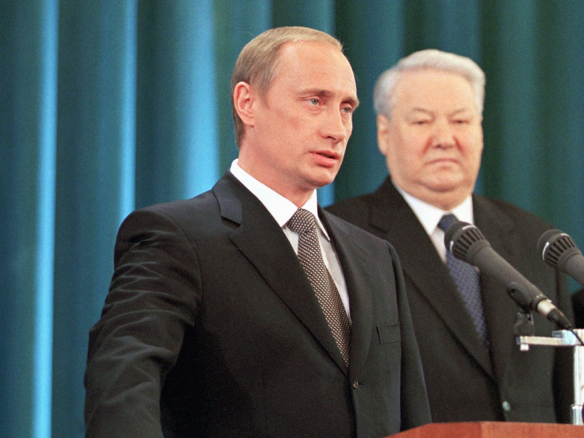  Putin taking the presidential oath beside Boris Yeltsin in May, 2000.