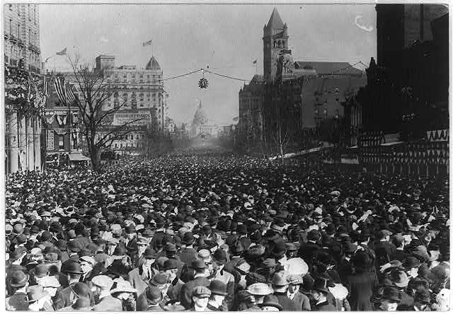 Crowds block the path of the Woman Suffrage Procession.