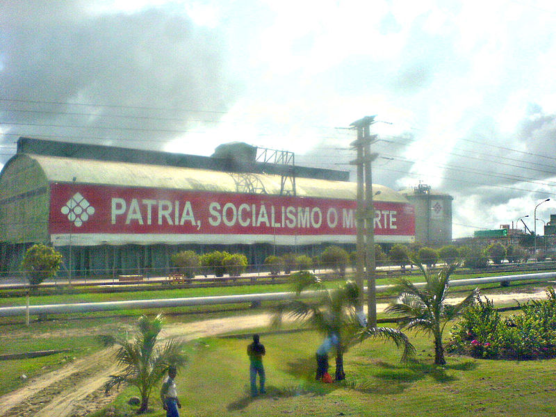 Petróleos de Venezuela, SA, the state-run oil company’s building in 2008 with a sign reading 'Fatherland, Socialism, or Death.'