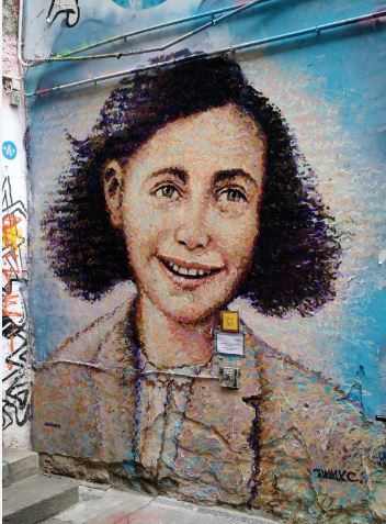Graffiti depicting Ann Frank celebrating what would have been her 87th birthday.