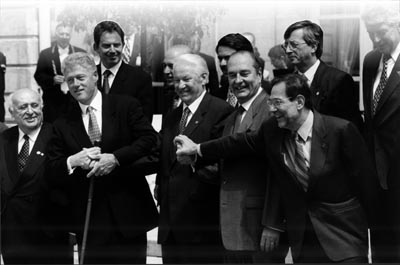 Russian President Boris Yeltsin (center) with NATO Secretary General Javier Solana (right) and U.S. President Bill Clinton.