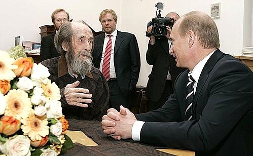 Russian President Vladimir Putin congratulating Solzhenitsyn in 2007.