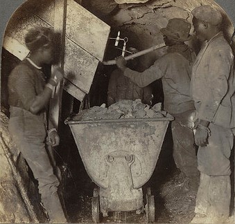 Black miners fill trucks with gold quartz in the Robinson Mine, Johannesburg, South Africa, 1906. Mining was a significant cause of lung disease