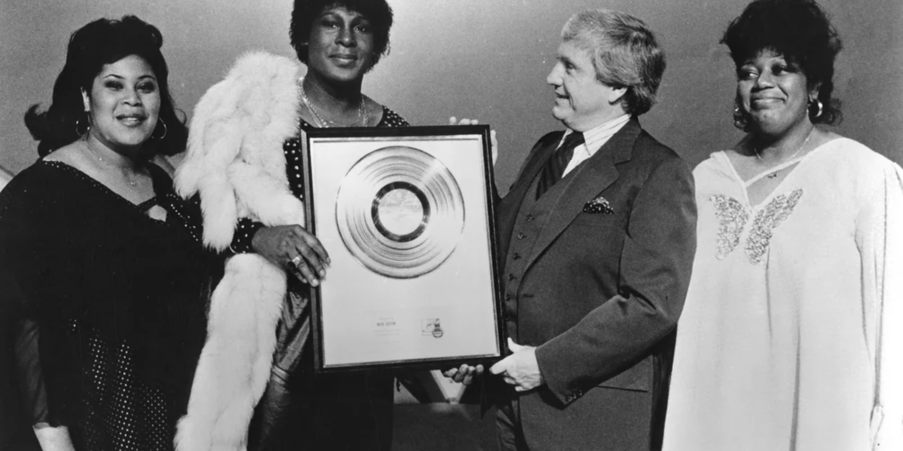 Sylvester receiving the RIAA Gold record for Step II, with Martha Wash and Izora Rhodes - Photo by Michael Ochs/Michael Ochs Archives/Getty Images