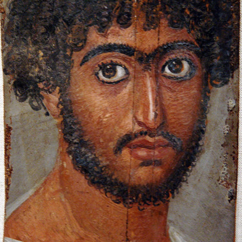 A mummy portrait of a bearded man from 100-300 C.E.