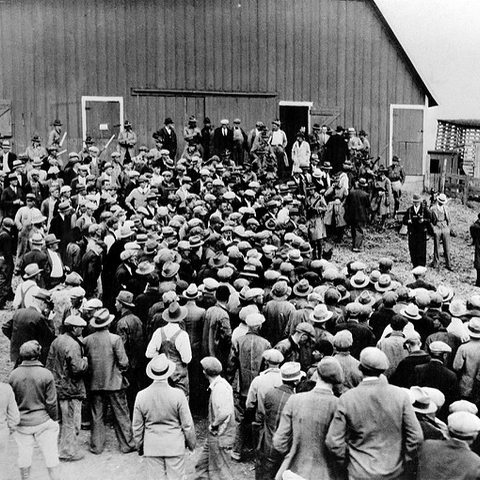 Farmers gathered at a foreclosure auction in Iowa during the 1930s.