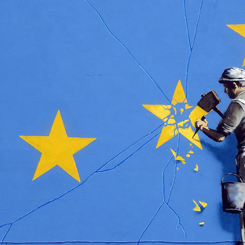 Banksy mural of worker chipping star off EU flag