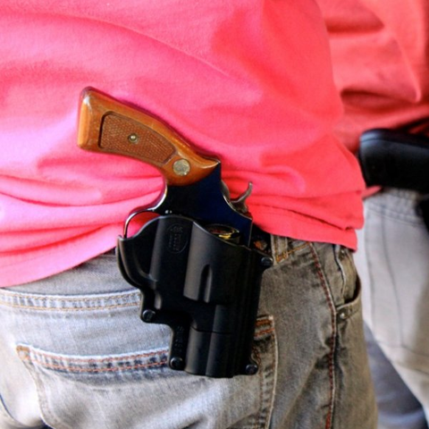 man with a gun in a holster