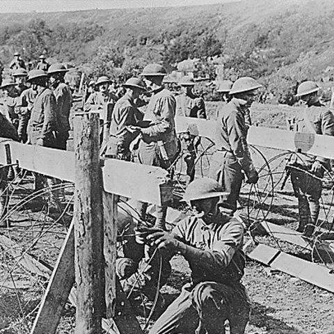 American soldiers making rolling barbed wire entanglements during World War I.
