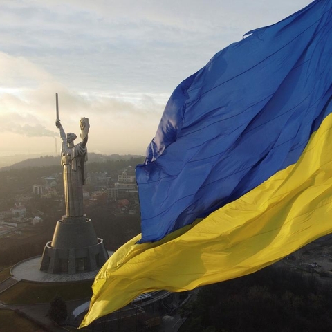 Statue and Ukrainian Flag