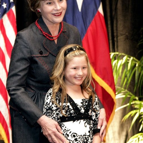 First Lady Laura Bush and Rae Leigh Bradbury, announcing the Texas Regional Office of the National Center for Missing and Exploited Children. Rae Leigh was the first child recovered through an AMBER Alert in 1998