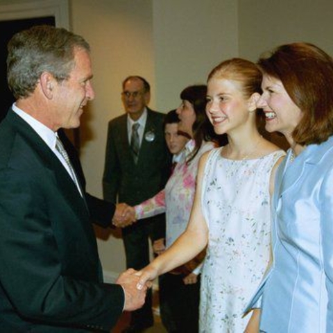 President George W. Bush greets Elizabeth Smart and her mother Lois in the White House at the signing of the Protect Act (April 2003)