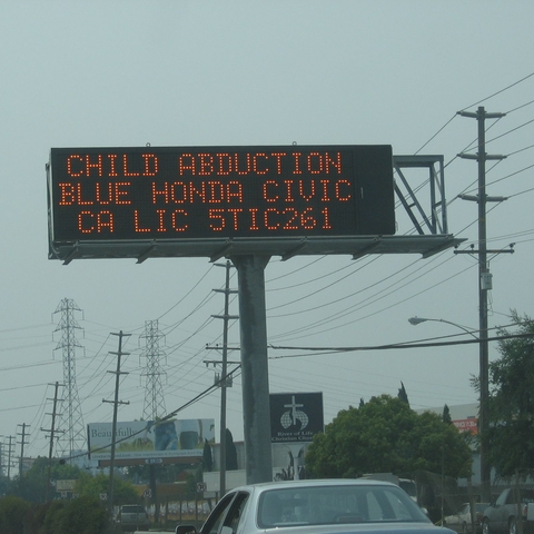 An electronic traffic-condition sign displaying an AMBER Alert.