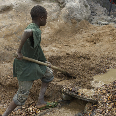 A child working in a Congolese gold mine.
