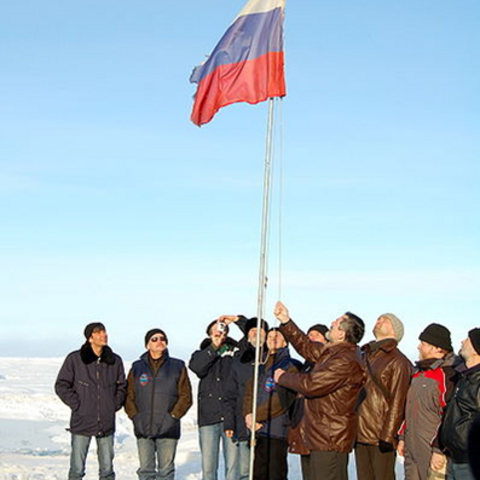 The Russian flag is lowered in August 2009 at the conclusion of work at the "North Pole 36" research station.
