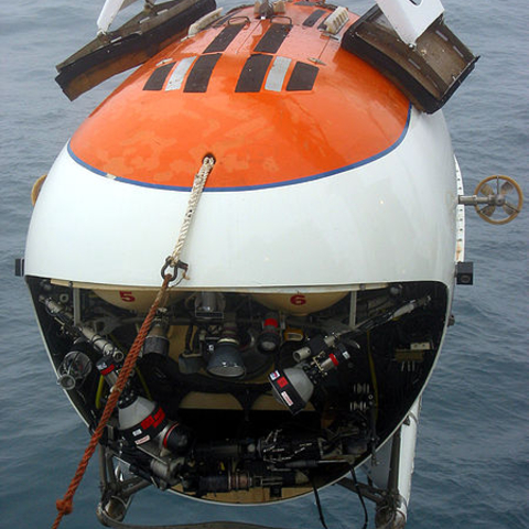Front view of the MIR submersible as it is hoisted into the water