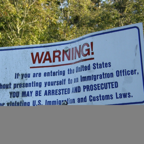 A warning sign at the U.S.-Canada border