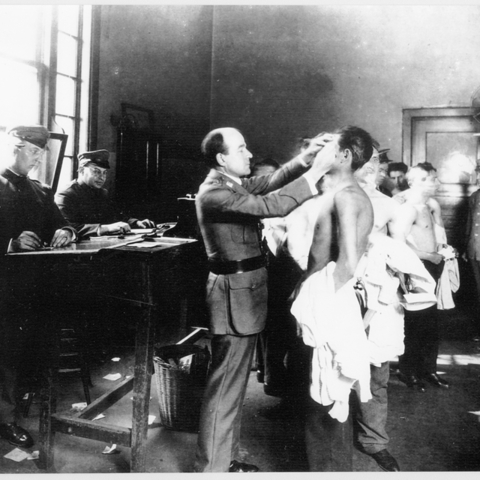 Health officials examining detainees at the Angel Island, California Immigration Station around 1917