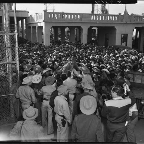 Workers in Mexico seeking legal employment in the United States as part of the Bracero program, 1954
