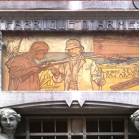 Ceramic illustration of an arms transaction over the entrance of the Lambert Sevart weapons factory in Liege, Belgium