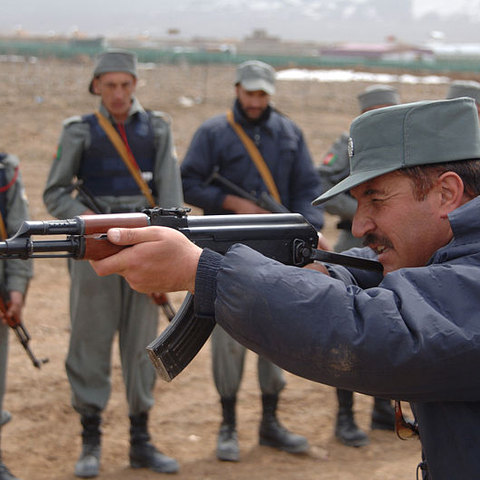 An Afghanistan National Police instructor demonstrates use of a Chinese-made AK-47 assault rifle.