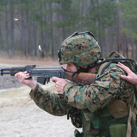 A U.S. Marine firing an AK-47