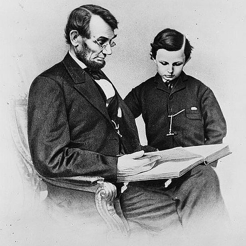 President Lincoln with his youngest son in 1864, two years after he signed the Morrill Land Grant Act