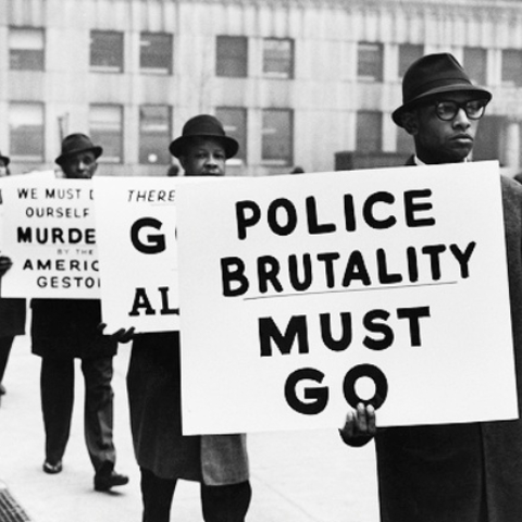 African Americans protest against police brutality in Harlem, New York.