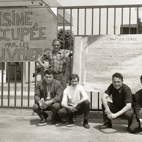 Striking factory workers in southern France with a sign reading 'Factory Occupied by the Workers' in June 1968.