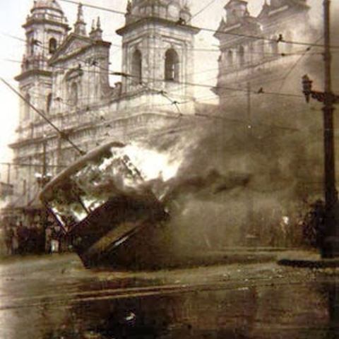 Riots in Bogotá in April 1948 engulf a trolley car in Bolívar Square.