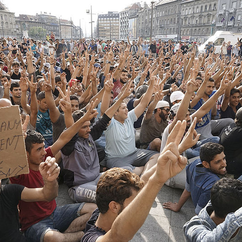 Syrian refugees protesting in front of the Budapest Keleti railway station.