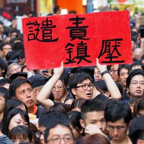One Hong Kong protester's sign reads, 'denounce repression.'