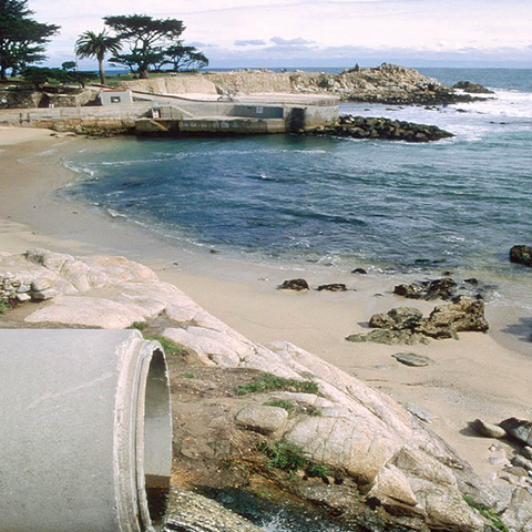 A storm drain emptying into California’s Monterey Bay National Marine Sanctuary.