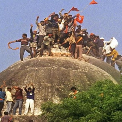 Rioters attack Babri Masjid in 1992.