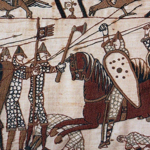 battle scene of men with axes fighting men on horseback