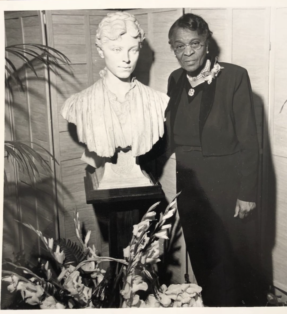 Dr. Charlotte Hawkins Brown and a bust of Alice Freeman Palmer