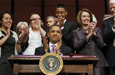 President Obama signing the new student loan legislation in March 2010.