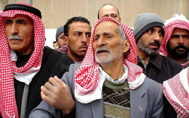 The father of a Syrian general killed in the civil war attends his son's funeral in Damascus in January 2012.