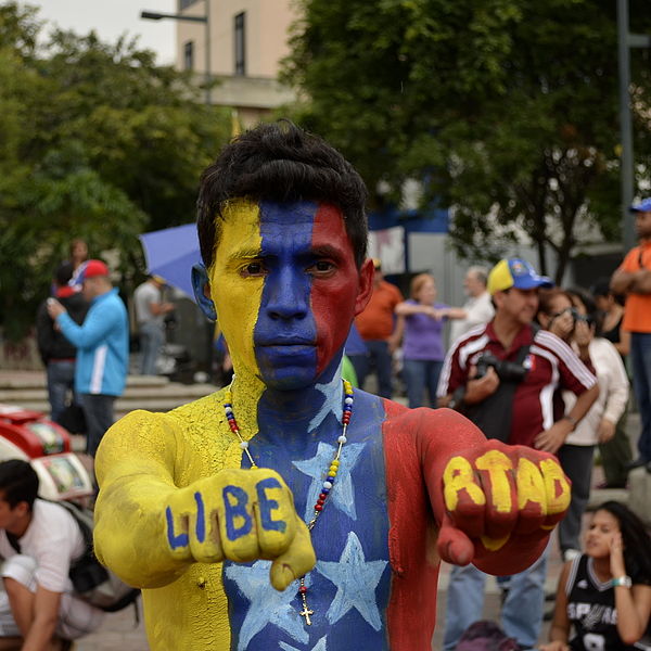 A protester against Venezuelan President Nicolás Maduro in 2014 with "Liberty" written on his hands.