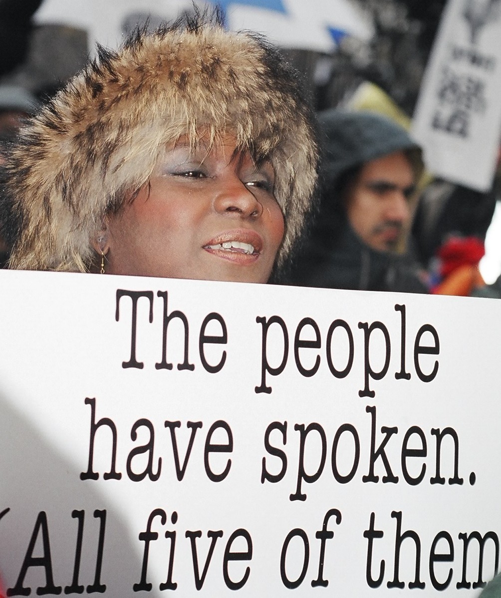 Woman with a protest sign in Washington D.C., 2001.