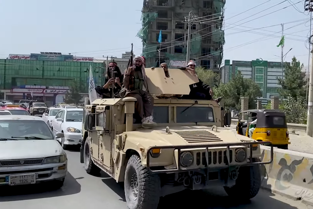 Taliban fighters patrolling the streets of Kabul in a Humvee, August 17, 2021.