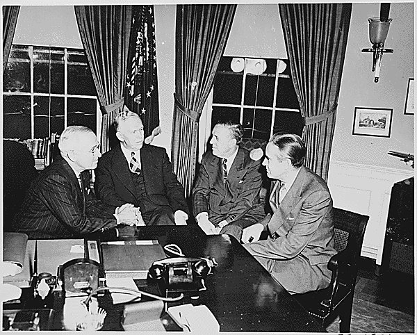 President Harry Truman meets with top advisors to discuss the Marshall Plan in November of 1948. From Left to Right, President Truman, George Marshall, Paul Hoffman, and Averell Harriman.