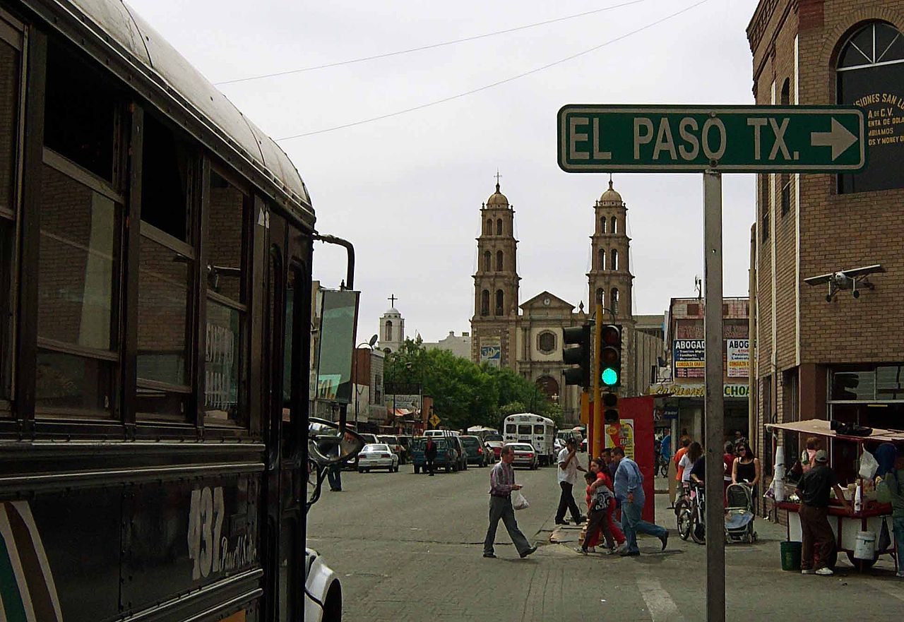 Ciudad Juárez, México near a road sign pointing to El Paso, Texas, U.S. in 2008.