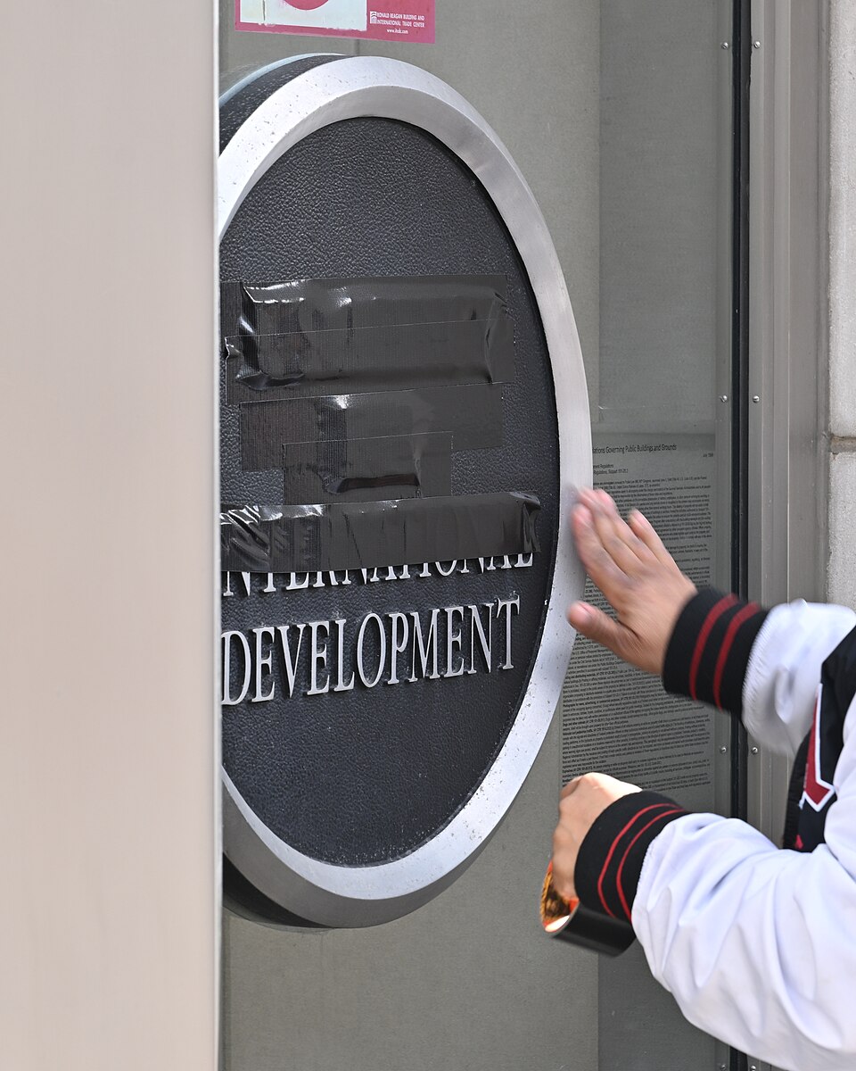 One of the signs at the main entrance to the US Agency for International Development (USAID) offices being taped over on February 7, 20205.