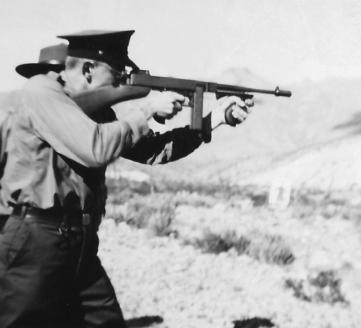 A US Border Patrol agent practice firing a gun near El Paso, Texas, 1940.