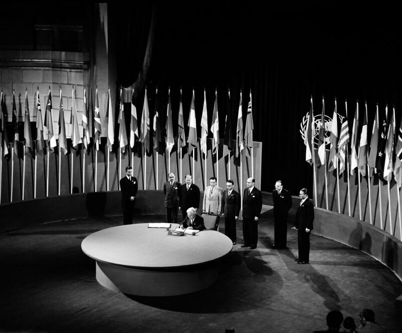 Faris El-Khouri, Prime Minister; Deputy for Damascus; Chairman of the Delegation from Syria, signing the UN Charter at a ceremony held at the Veterans' War Memorial Building on 26 June 1945.