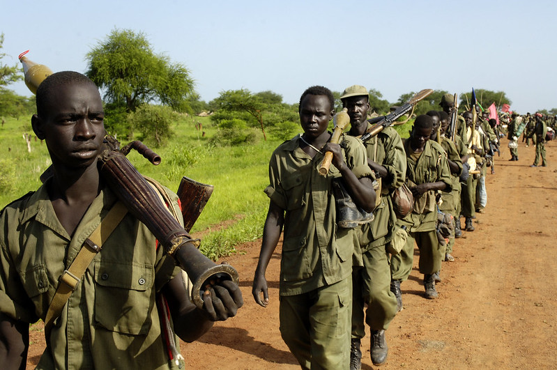 Soldiers of the Sudanese People's Liberation Army (SPLA) redeploy to form a new Joint Integrated Unit (JIU) battalion with the Sudan Armed Forces (SAF), 2010. UN Photo/Tim McKulka.  